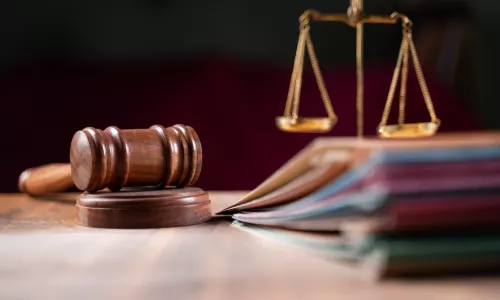 gavel and scales of justice on a table