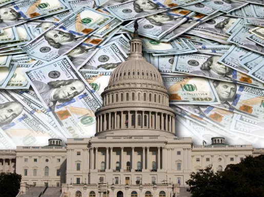 United States Capitol in DC against a background of 100 dollar bills
