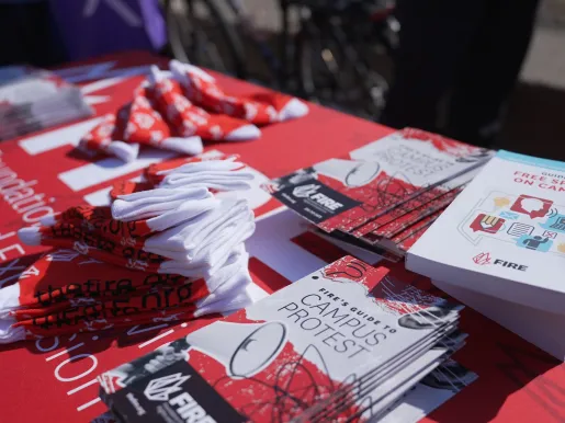 FIRE table at University of Illinois Urbana Champaign 2026 with flyers tshirts and Guide to Free Speech on Campus.JPG (516.62 KB)