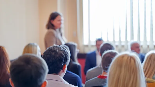 Adult students listen to speaker