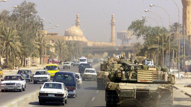 A Marine Corps M1 Abrams tank patrols Baghdad after its fall in 2003