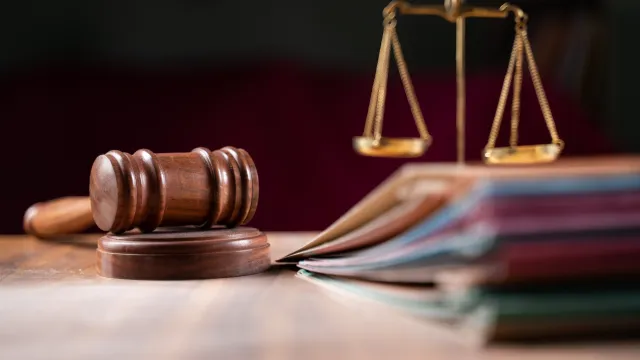 gavel and scales of justice on a table