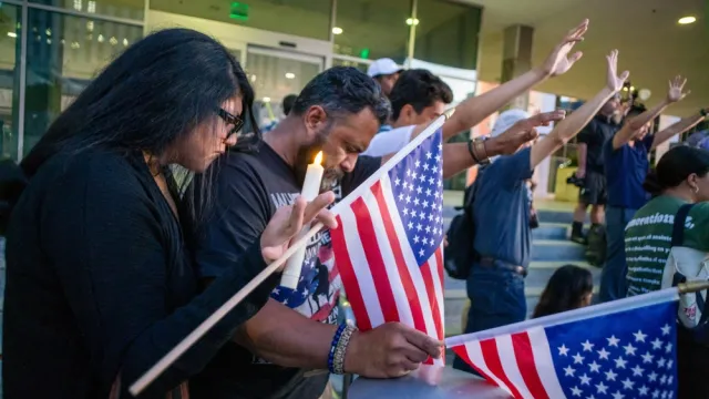 People attend a vigil for Charlie Kirk in Los Angeles on Sept. 11