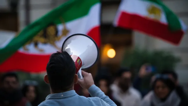 Protester against Iran regime holding a bullhorn